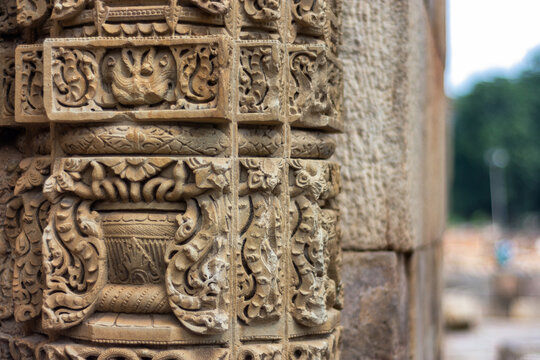Stone carvings on the cloister columns at Quwwat ul-Islam Mosque in Qutb Minar complex