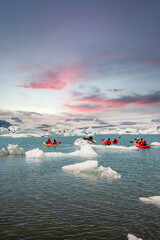 kayaking in Iceland next to an iceberg