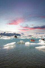 kayaking in Iceland next to an iceberg