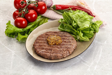 Frilled beef burger cutlet with iceberg