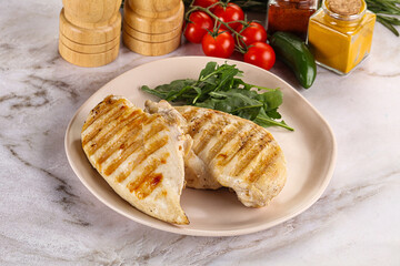 Grilled chicken breast served arugula