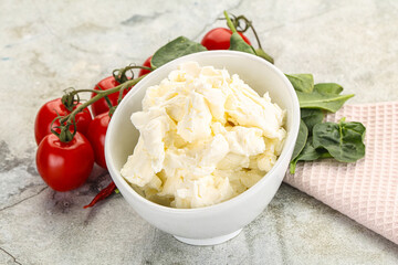 Soft cream cheese in the bowl