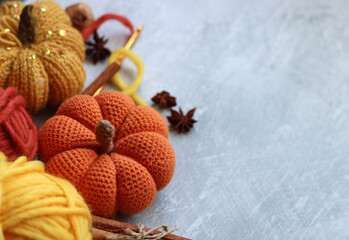 Cozy autumn crochet. Close up photo of handmade amigurumi toys on textured background with copy...