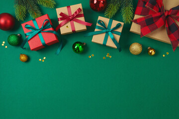 Merry Christmas and Happy New Year concept with gift box, ornaments and decorations on green...
