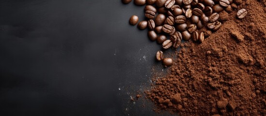 Coffee beans and ground coffee on gray background with blank space above view