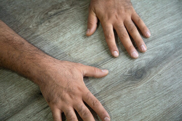 Caucasian human hand on the table.