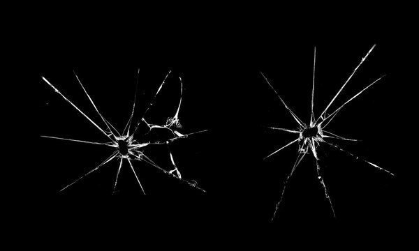 Cracked glass window. Texture of craced glass. Isolated realistic cracked glass effect.  Bullet holes.  Abstract black and white 3D illustration 
