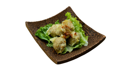 Thailand food appetizers menu of Pork dumplings wrapped in yellow dumplings. Arrange on top of Lettuce or Epicurious. Served on a coconut plate. Isolated white background. 