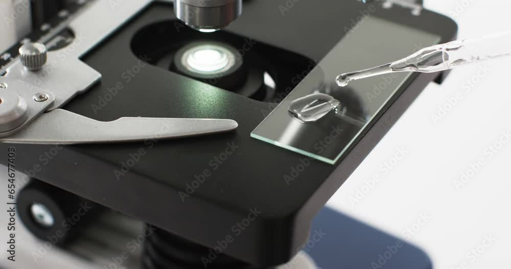 Poster video of close up of laboratory microscope with copy space on white background