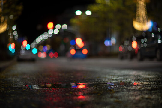 Blurred Footage Of Transport. Blur Of City Lights Along The Road, Light Out Of Focus At Night. Night City Traffic, Beautiful Background.