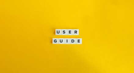 User Guide Inscription on Letter Tiles on Yellow Background. Minimal Aesthetic.