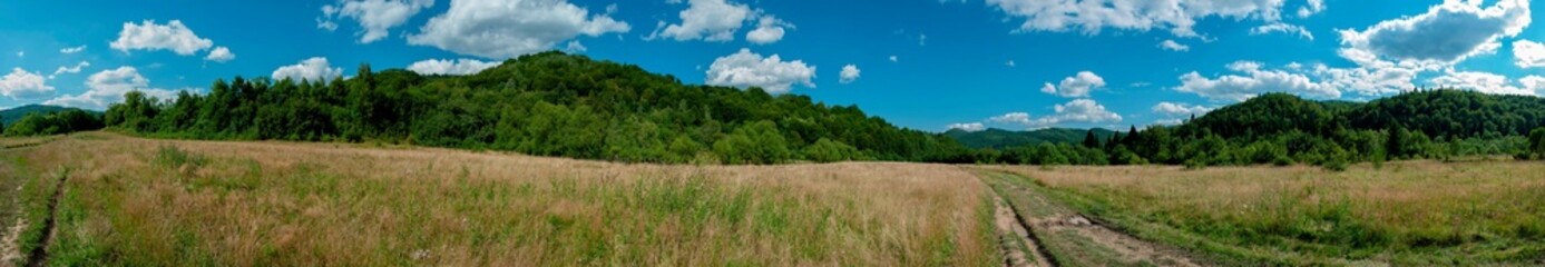 road in the mountains in autumn sunny day