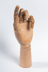 The wooden arm of a mannequin.