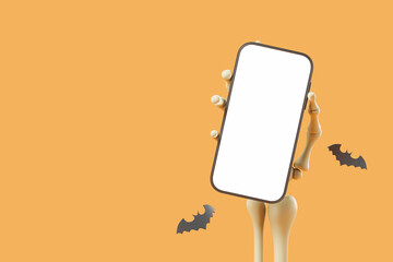 Skeleton hand holding a mock up smartphone, empty display on orange background