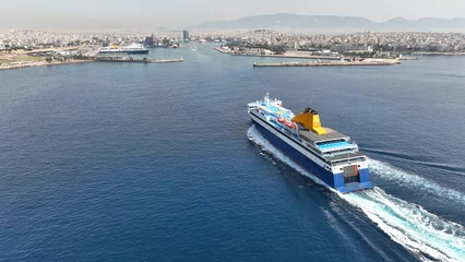 Poster Aerial drone photo of passenger ferry reaching destination - busy port of Piraeus, Attica, Greece © aerial-drone