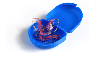 Acrylic dental retainer in box on white background, Healthy teeth and tooth hygiene concept - obrazy, fototapety, plakaty