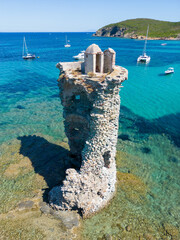Aerial view of Corsica's step coastline and a lighthouse, Island, Mediterranean, France - 654719680