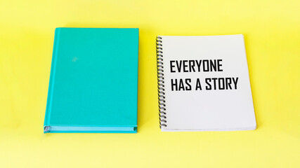 Word concept Everyone has a story on notepad and yellow background
