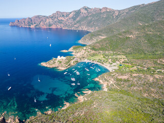 Aerial drone view of Port de Girolata, a remote village on Corsica island, France, Europe. - 654728420