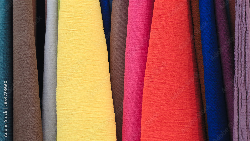 Aufkleber mix colorful hanging vertical stripe textile, fabrics, cloths on the rack. texture of multicolored f