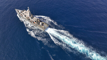 Aerial drone photo of armed navy frigate cruising deep blue sea