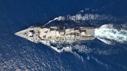 Aerial drone photo of armed navy frigate cruising deep blue sea