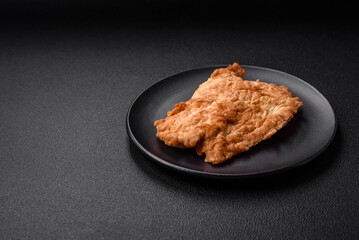 Delicious fried chicken chop or pork meat fried breaded with salt, spices and herbs