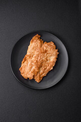 Delicious fried chicken chop or pork meat fried breaded with salt, spices and herbs