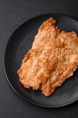 Delicious fried chicken chop or pork meat fried breaded with salt, spices and herbs