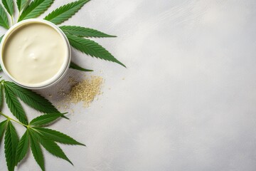 Fototapeta na wymiar CBD oil cannabis salve leaves and hemp seeds against a spa themed backdrop