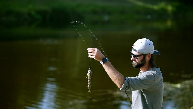 Fisher pilling perch . Angler ultralight catching pike	