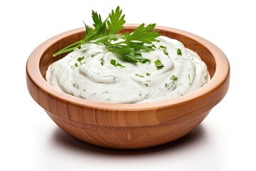 Sour cream and various ingredients in a wooden bowl accompanied by mayonnaise and yogurt isolated on a white background with full depth of field