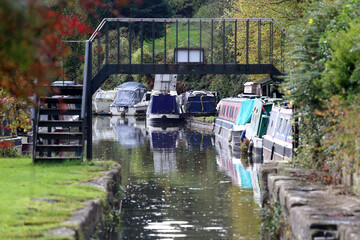 Canal boats mooring on Somerset Coal Canal, next to Dundas Aqueduct, Limpley Stoke, England, United Kingdom.