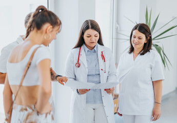 Fototapeta premium Experienced Female Doctors Providing Healthcare Solutions at Hospital Hall