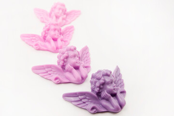 Baby angel greeting card background. Handmade natural soap mold. Making crafts at home.
