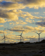 The silhouette of three wind turbines is silhouetted against the sky. Abades, Tenerife