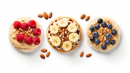 Rice cakes with nuts, banana, peanut butter, berries top view isolated on white background
