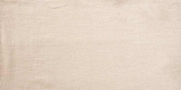 Fine bright linen cloth. Tablecloth on top view. Background for wedding and birthday celebrations in natural boho style with space for text.
