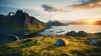 Fotobehang wild camping in the Lofoten islands. camping tent among mountains. sunset over a camping spot behind the Polar Circle. Panorama of the perfect landscape during the midnight sun © BOMB8