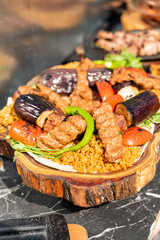 delicious bbq kebab grilling on open grill, outdoor kitchen. food festival in city. tasty food roasting on skewers, food-court. summer picnic