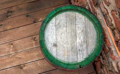 Traditional wooden barrel on street outdoors. Wine making