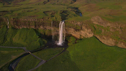 The Seljalandsfoss waterfall on the south coast of Iceland bathed in the otherworldly light of the...