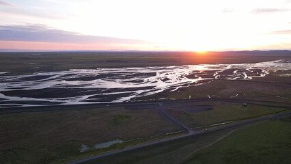 Markarfljót is a river in the south of Iceland. The main sources for the river are the glaciers Mýrdalsjokull and Eyjafjallajokull. Midnight sun at the Markarfjot estuary.