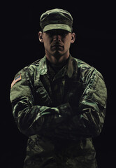 Soldier, man with arms crossed and army warrior in war, conflict and battle with uniform on black background. Hero, military and camouflage with security, protection and mission for fight in studio