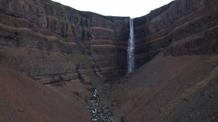 AERIAL VIEW Hengifoss is a waterfall that runs from the river Hengifossá in the municipality of...