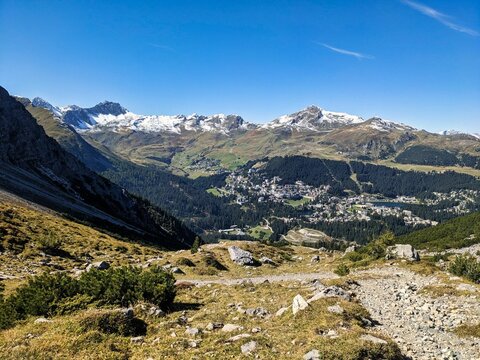 View of the beautiful mountain village of Arosa in the Graubünden mountains. Autumn hike above Arosa. High quality photo