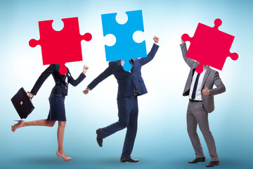 Concept of business people and jigsaw puzzle