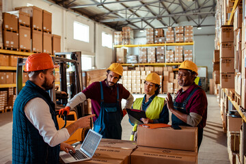 Group of diverse people doing inventory while working in a warehouse