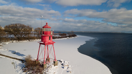 Alpena, Michigan historic lighthouse along Lake Huron in the winter.