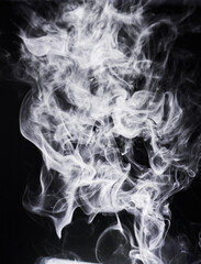 Smoke, incense or gas in a studio with dark background by mockup space for magic effect with abstract. Fog, steam or vapor mist moving in air for cloud smog pattern by black backdrop with mock up.
